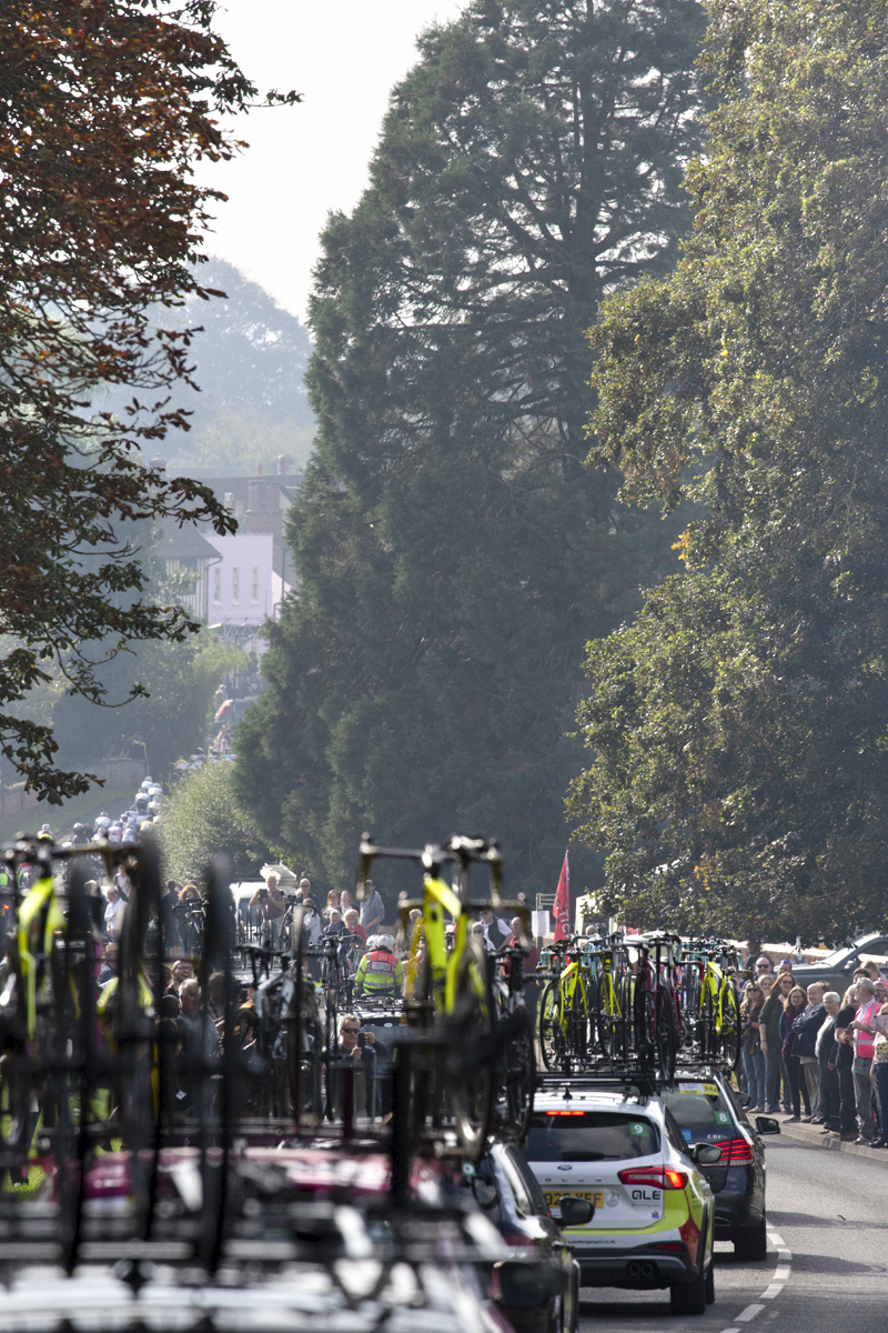 Women’s Tour 2021 - The race convoy passes through Long Melford as fans line to roadside