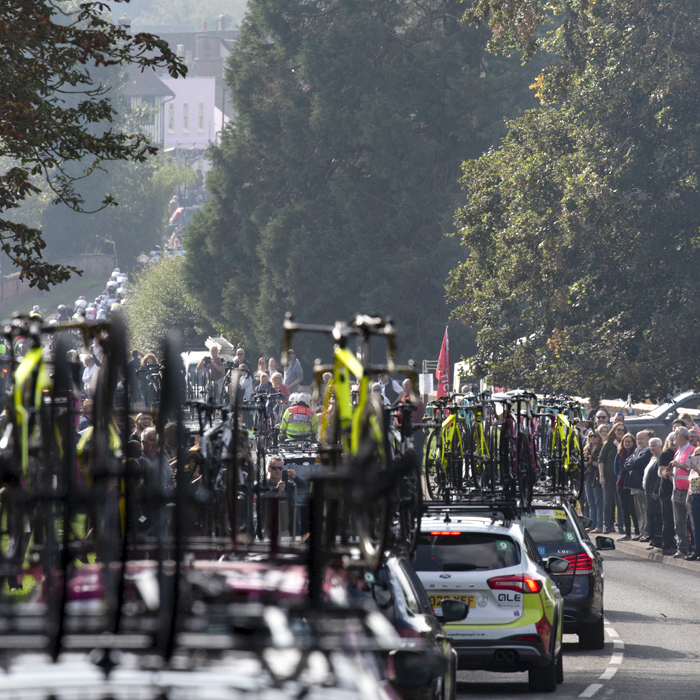 Women’s Tour 2021 - The race convoy passes through Long Melford as fans line to roadside