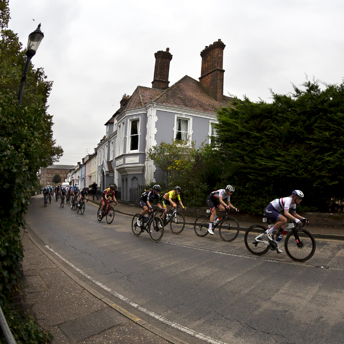 Women’s Tour 2021 - The peloton passes a row of grand houses on its way through Mistley