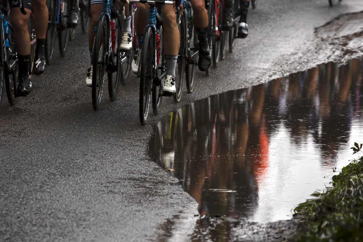 Women’s Tour 2021 - The peloton is reflected in a large puddle