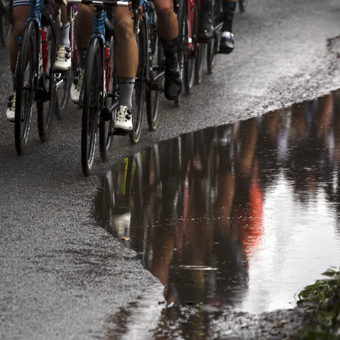 Women’s Tour 2021 - The peloton is reflected in a large puddle