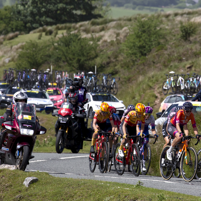 Women’s Tour 2022 - A group of riders start to make their way up Black Mountain