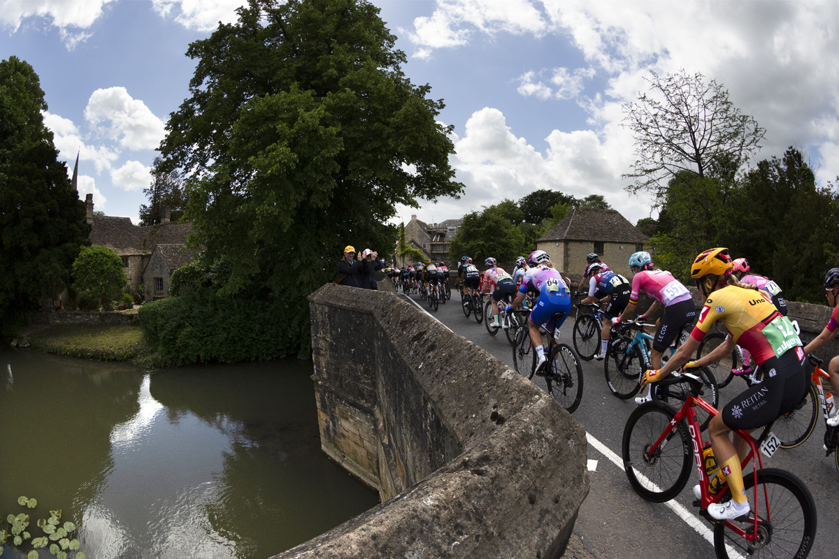 Women’s Tour 2022 - Riders are seen exiting the bridge and heading into Burford