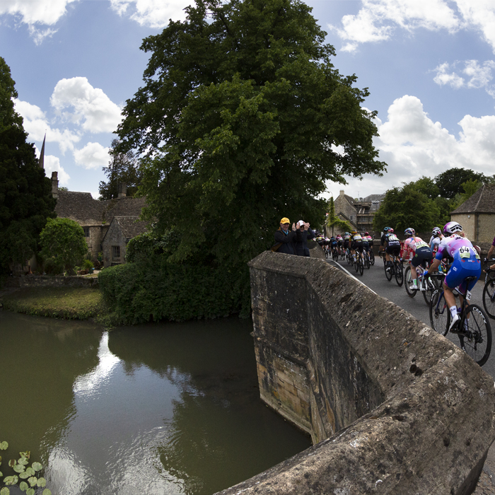 Women’s Tour 2022 - Riders are seen exiting the bridge and heading into Burford