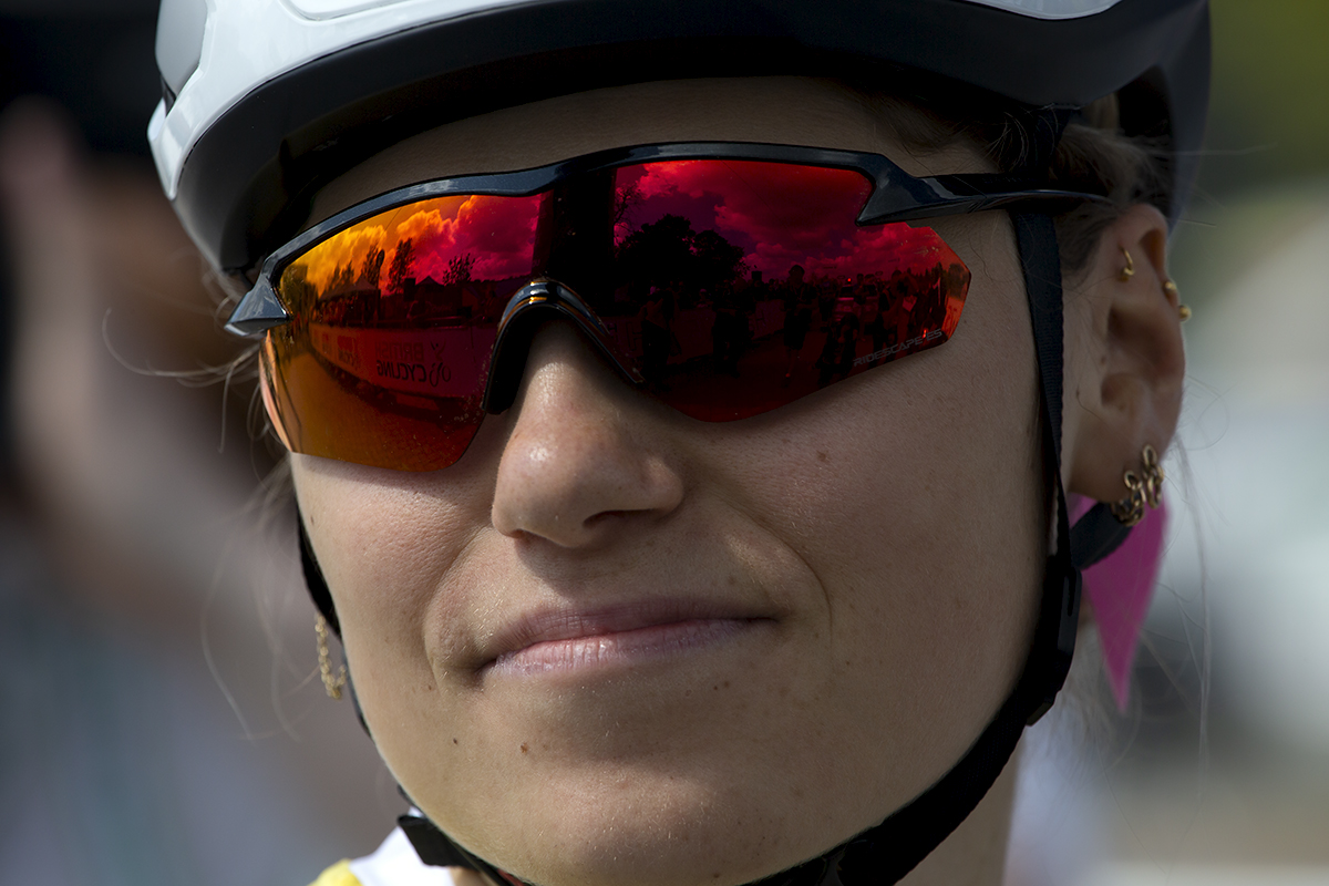 Women’s Tour 2022 - Clara Capponi of FDJ Nouvelle Aquitaine Futuroscope with the hoarding reflected in her glasses before the race start