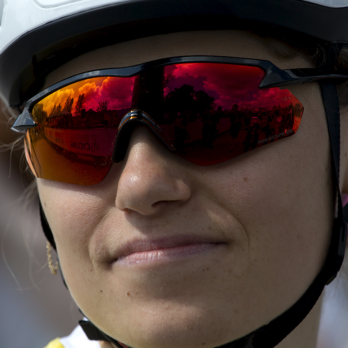 Women’s Tour 2022 - Clara Capponi of FDJ Nouvelle Aquitaine Futuroscope with the hoarding reflected in her glasses before the race start