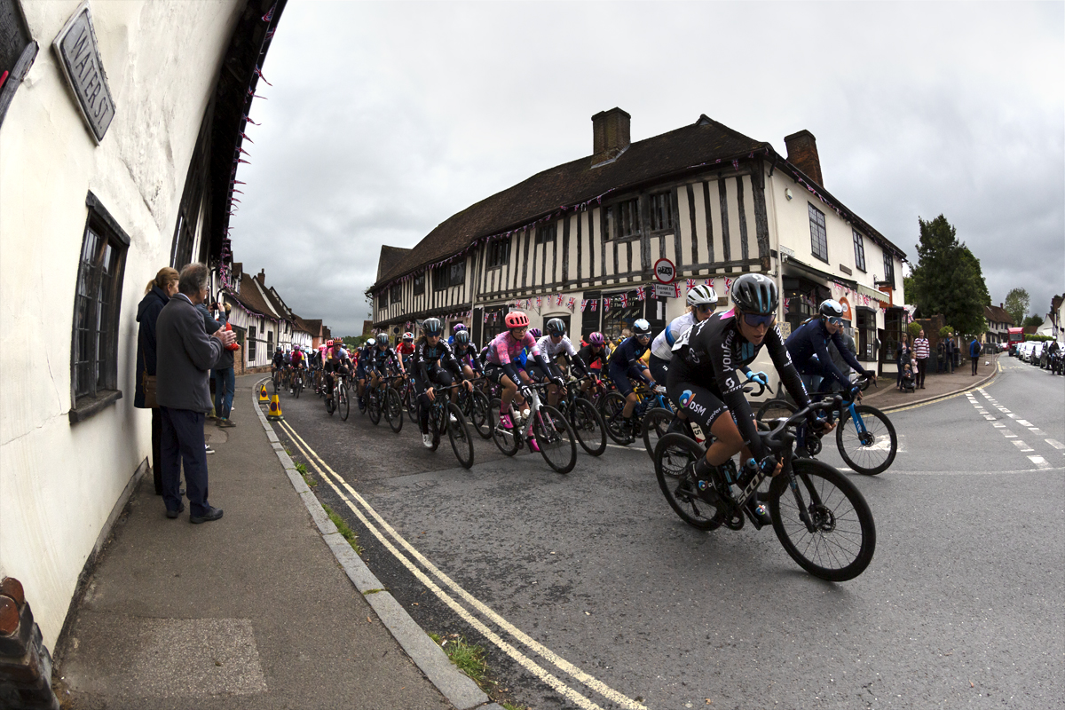 Women’s Tour 2022 - The peloton round the corner in Lavenham