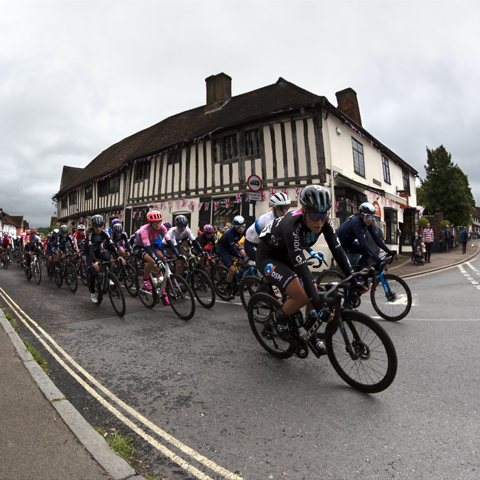 Women’s Tour 2022 - The peloton round the corner in Lavenham