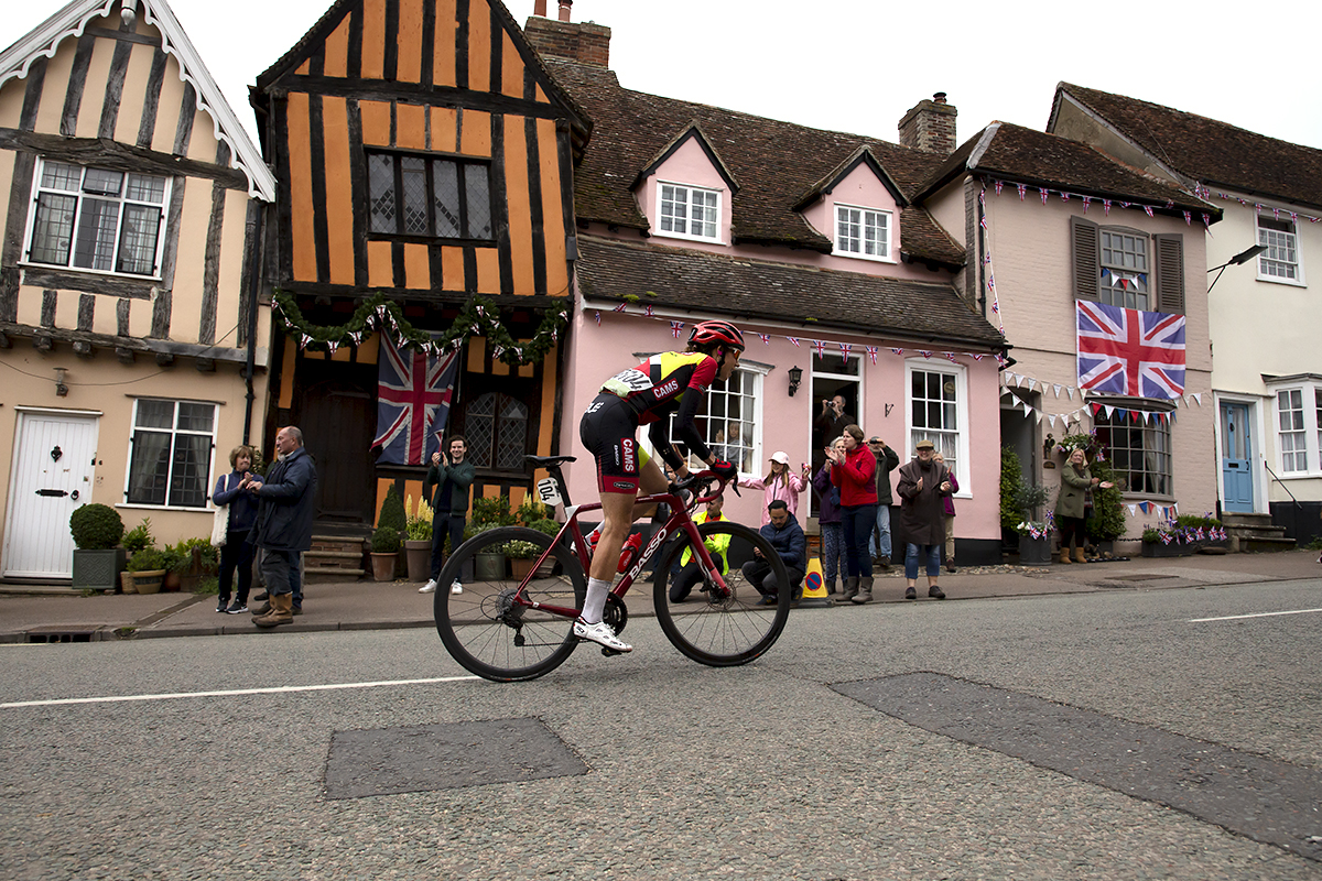 Women’s Tour 2022 - Danielle Shrosbree of Cams Basso climbs past the Crooked House, an old half timber Tudor house in Lavenham