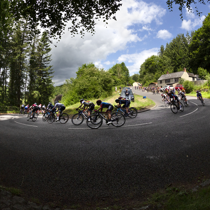 Women’s Tour 2022 - The peloton take on a switchback on the descent in Lydbrook, Forest of Dean